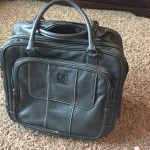 Kenneth Cole Reaction gray roller bag